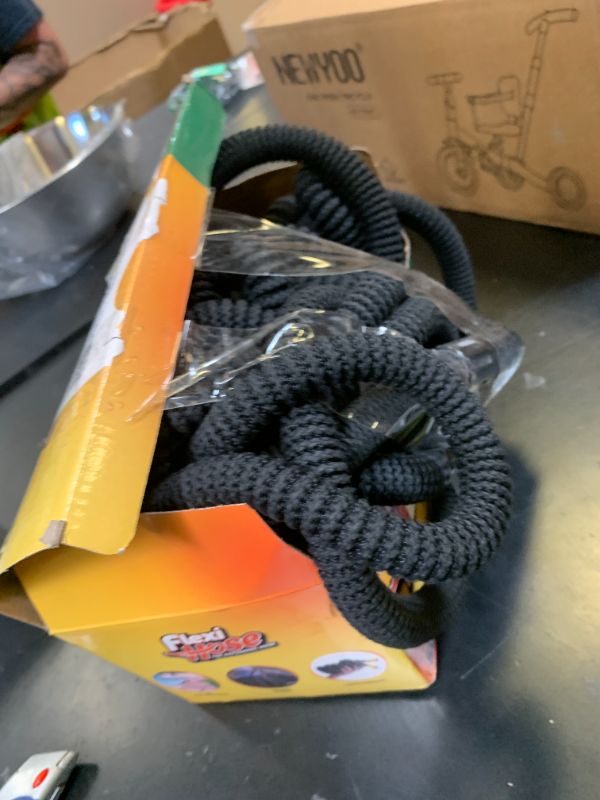 Photo 1 of Flexi Hose Expandable Garden Hose with 8 Function Nozzle, 50FT - Lightweight Retractable Garden Hose, Water Hose - No-Kink Flexibility, 3/4 Inch Solid Brass Fittings and Double Latex Core