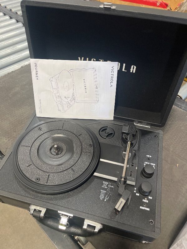 Photo 1 of ***DOES NOT POWER ON, FOR PARTS ONLY***Victrola Journey Bluetooth Portable Suitcase Record Player – with Built-in Speakers, 3 Speed Vinyl Record Player, RCA Out, Headphone Jack (Black)