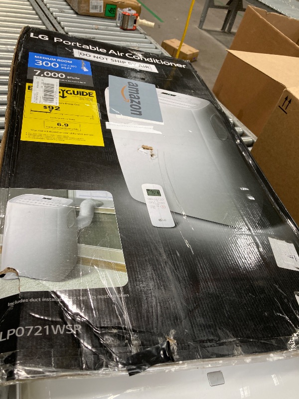 Photo 1 of ***The unit is missing a wheel and cannot stand properly and is leaking water from the bottom.***LG 7,000 BTU (DOE) 10,000 BTU (ASHRAE) Portable Air Conditioner, 115V, Cools 300 Sq.Ft. (12' x 25' Room Size), Quiet Operation, LCD Remote Control, and Window