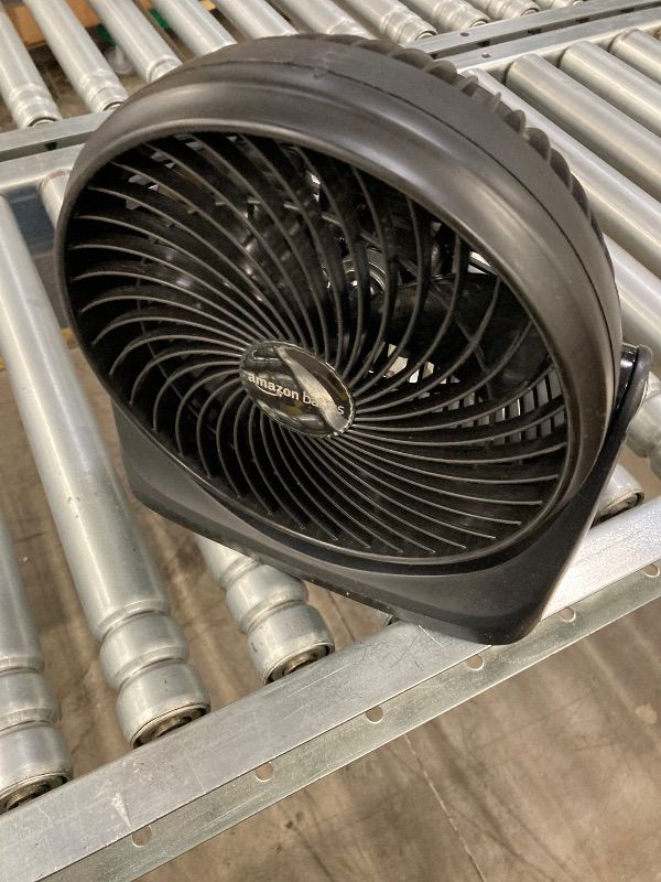 Photo 1 of ***DAMAGED -NON-FUNCTIONAL -SELLING AS PARTS ONLY*** Amazon Basics Air Circulator Desk Fan for Bedroom, Home and Office, 90-Degree Tilt Head, 3 Speed Settings, Cooling, 35 Watts, Black, 11.1"W x 6.3"D x 10.9"H