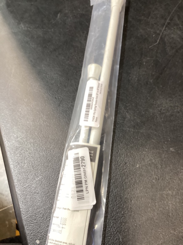 Photo 1 of TYRON 1Pcs Spring Tension Curtain Rod 28 to 40 Inch, White, Adjustable Small Tension Rods, Window Curtain Rod No Drilling