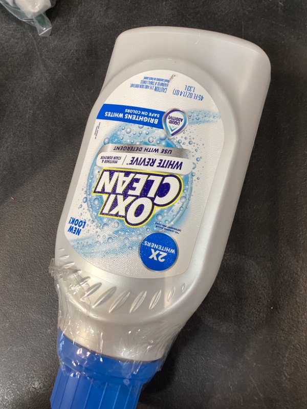 Photo 1 of OxiClean White Revive Whitener & Stain Remover Liquid Additive, Water-Activated Oxygen Bleach for Laundry, 45 fl oz