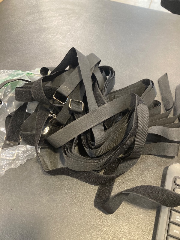Photo 1 of black nylon utility straps designed for securing luggage, backpacks, or other heavy objects.
