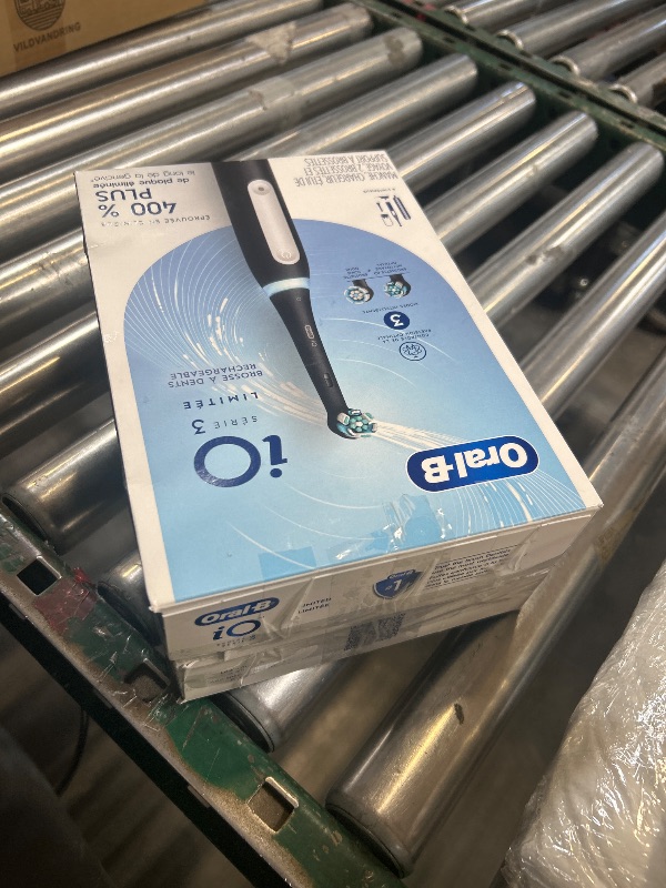 Photo 1 of Oral-B iO Series 3 Limited Deep Clean Rechargeable Electric Toothbrush for Adults, Black, 3 Modes, Smart Pressure Sensor, Plaque Removal and Gum Care, 2 Replacement Brush Heads, Travel Case