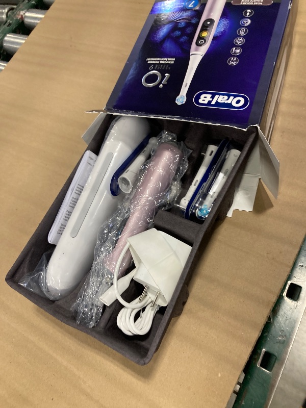 Photo 1 of Oral-B Rechargeable Electric Toothbrush, iO9 Genius, 7 Cleaning Modes, Interactive Display, Charging Travel Case, Visible Pressure Sensor, 4 Brush Heads, Rose Quartz