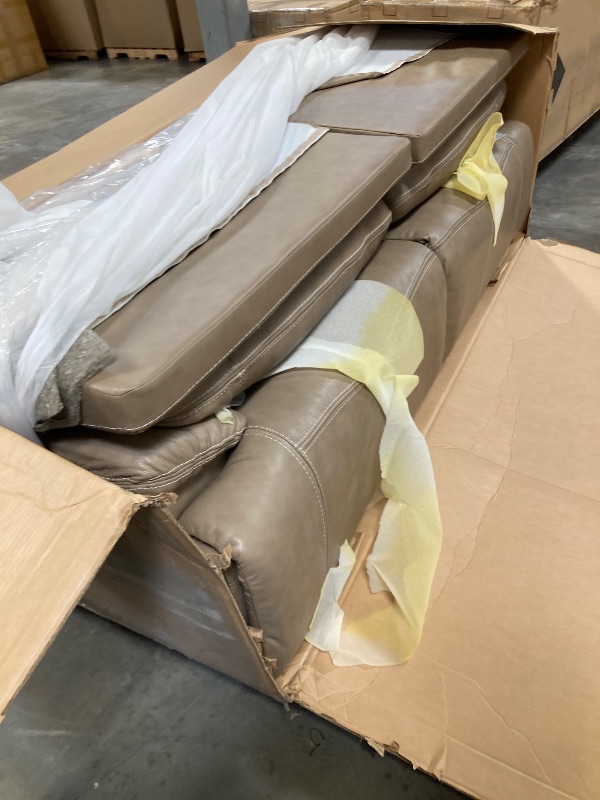 Photo 1 of Signature Design by Ashley Ricmen Leather Adjustable 2 Seat Power Reclining Sofa with USB Charging, Light Brown----FACTORY SEALED -----PLEASE BRING TRUCK UPON PICK UP ITEM IS XL