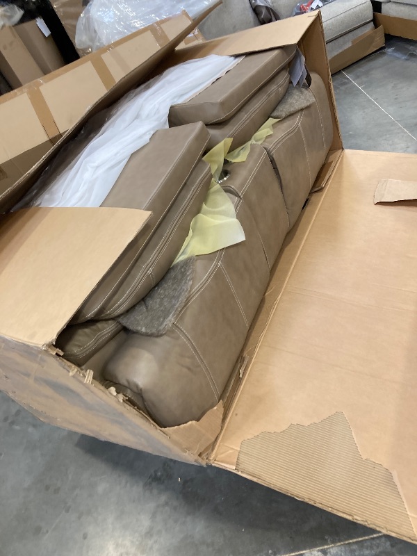 Photo 1 of Signature Design by Ashley Ricmen Leather Adjustable Dual Sided Power Reclining Loveseat with USB Charging & Console, Light Brown----PLEASE BRING TRUCK UPON PICK UP ITEM IS XL -------FACTORY SEALED 
