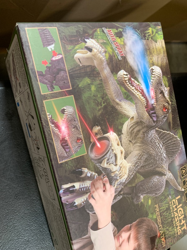 Photo 1 of Upgraded Dinosaur Toys for Kids 3-5-7 Years Old, Remote Control Spinosaurus Toys with Indicator Light Chasing&Spray& Roar, Realistic RC Walking Dinosaur Robot Gifts Stocking Stuffers for Kids Boys