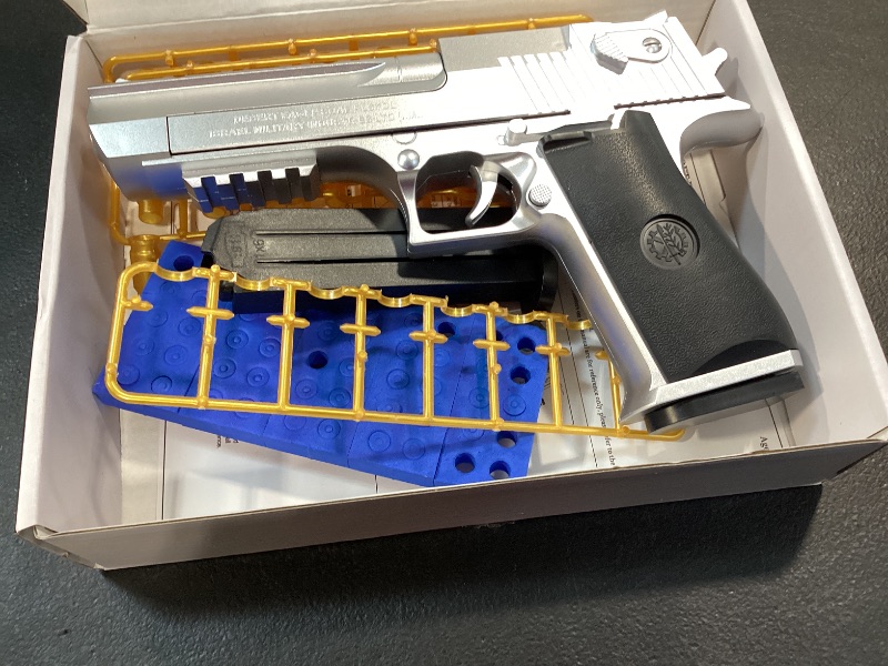 Photo 1 of DaoDaoZhu Soft Bullet Toy Gun Pistol Shell Ejecting, Fake Prop Gun Silver