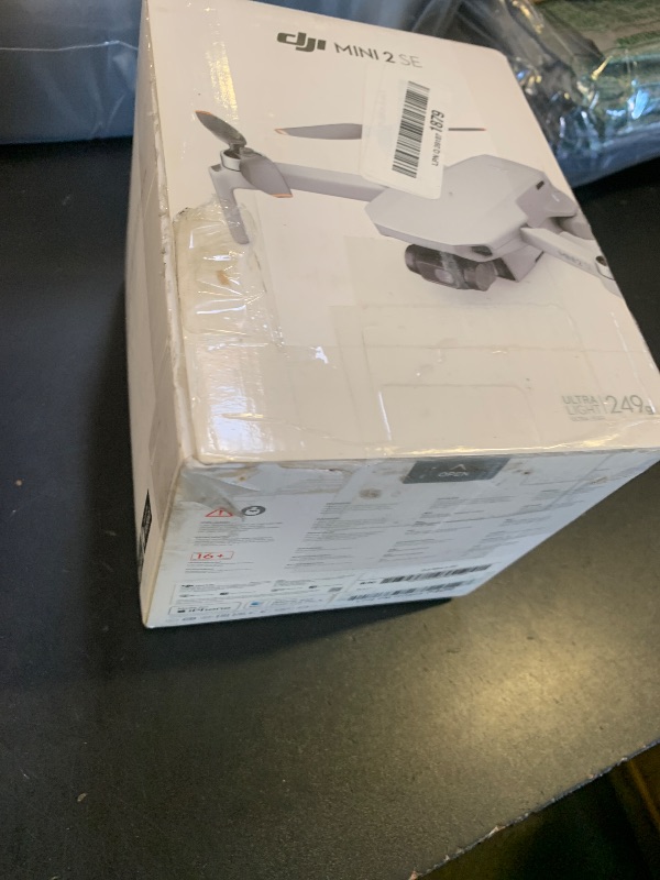 Photo 1 of DJI Mini 2 SE, Lightweight Mini Drone with QHD Video, 10km Max Video Transmission, 31-Min Flight Time, Under 249 g, Auto Return to Home, 3-Axis Gimbal Drone with Camera for Beginners