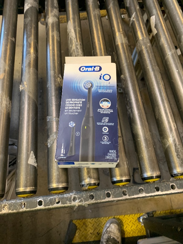Photo 1 of Oral-B Rechargeable Electric Toothbrush, iO2 Starter Kit, 3 Cleaning Modes, Automatic Pressure Sensor to Protect Gums, 2 Brush Heads, Night Black