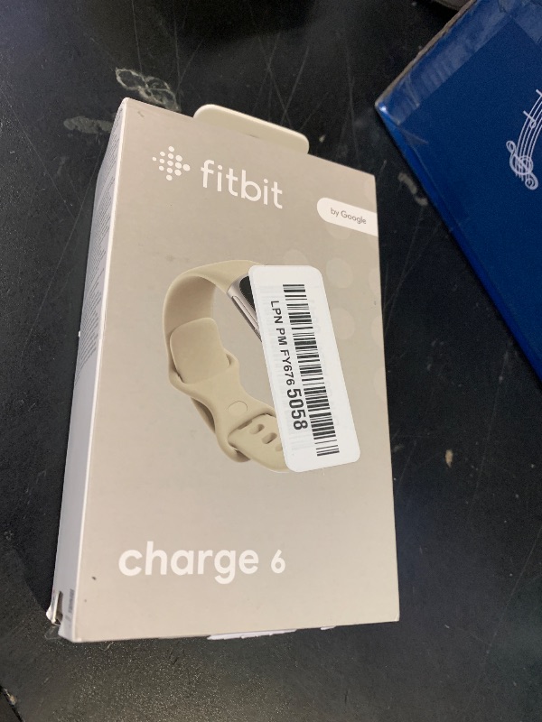 Photo 1 of Fitbit Charge 6 Fitness Tracker with Google Apps - Heart Rate on Exercise Equipment - 3-Month Google Health Premium Membership Included - Health Tools - Porcelain/Silver - Small&Large Bands Included