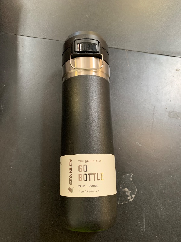 Photo 1 of Stanley Quick Flip GO Water Bottle 24 oz | Push Button Lid | Leakproof and Packable for Travel and Sports | Insulated Stainless Steel | BPA-Free | Black 2.0