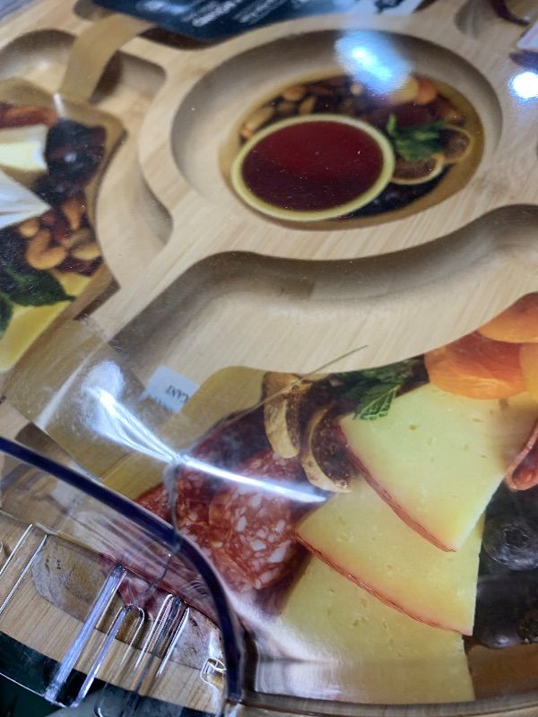 Photo 1 of ***DAMAGED - SEE NOTES/PICTURES***
Small Crack in Cover
Farberware Bamboo Cutting Board with Clear Locking Lid, 14 Inch Round Charcuterie Board with 5 Compartments, Make and Take Serving Tray for Charcuterie, Snacks, Fruits, and Veggies