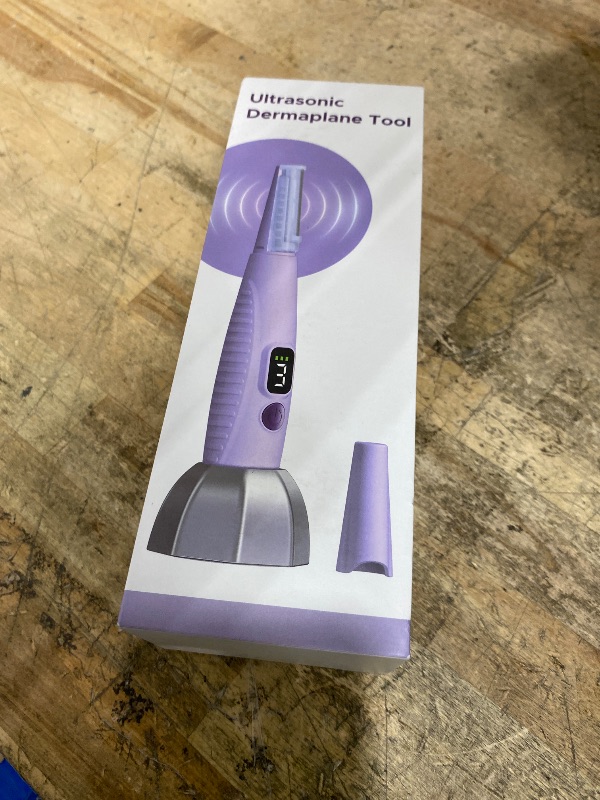 Photo 1 of **FACTORY SEALED**  Sonic Dermaplaning Tool for Face, Facial Exfoliation & Peach Fuzz Hair Removal with 12 Rechargeable Blades, 3 Speeds Dermaplane Razor for Women Face, Purple