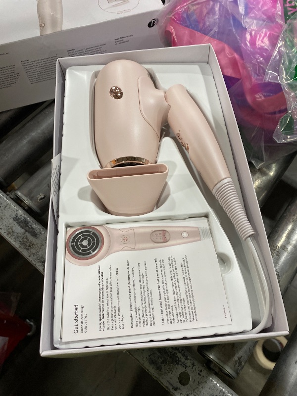 Photo 1 of T3 Afar Lightweight Travel-Size Hair Dryer with Auto Dual Voltage, Folding Handle, Fast Drying, Lightweight and Ergonomic, Frizz Smoothing, Multiple Heat and Speed Combinations