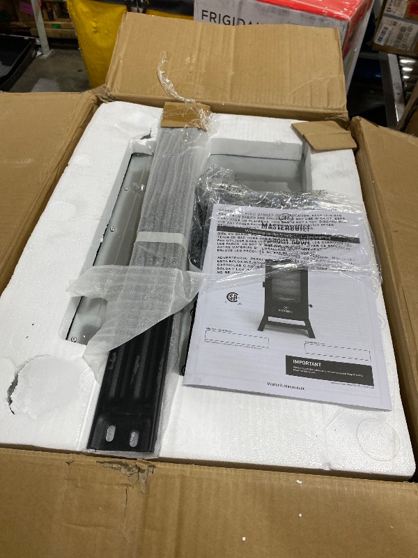 Photo 1 of Masterbuilt® 40-inch Digital Electric Vertical BBQ Smoker with Leg Kit, Side Wood Chip Loader and 970 Cooking Square Inches in Black, Model MB20070122
