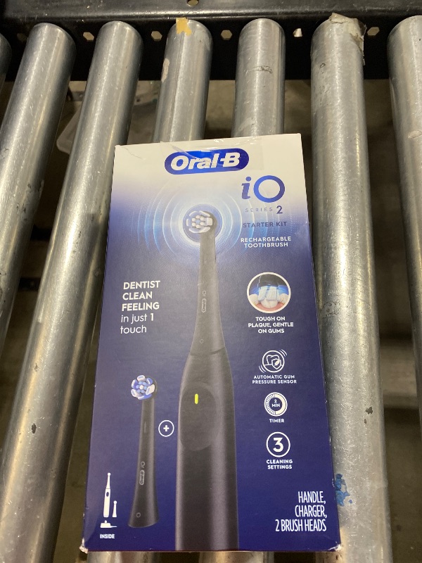 Photo 1 of Oral-B Rechargeable Electric Toothbrush, iO2 Starter Kit, 3 Cleaning Modes, Automatic Pressure Sensor to Protect Gums, 2 Brush Heads, Night Black