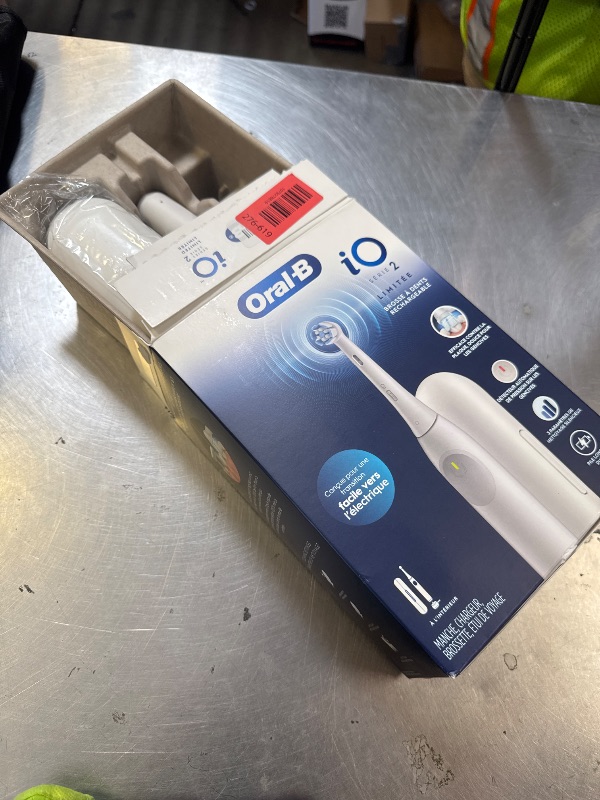 Photo 1 of Oral-B Rechargeable Electric Toothbrush, iO Limited Simple Clean, 3 Cleaning Modes, Automatic Pressure Sensor to Protect Gums, Travel Case, White