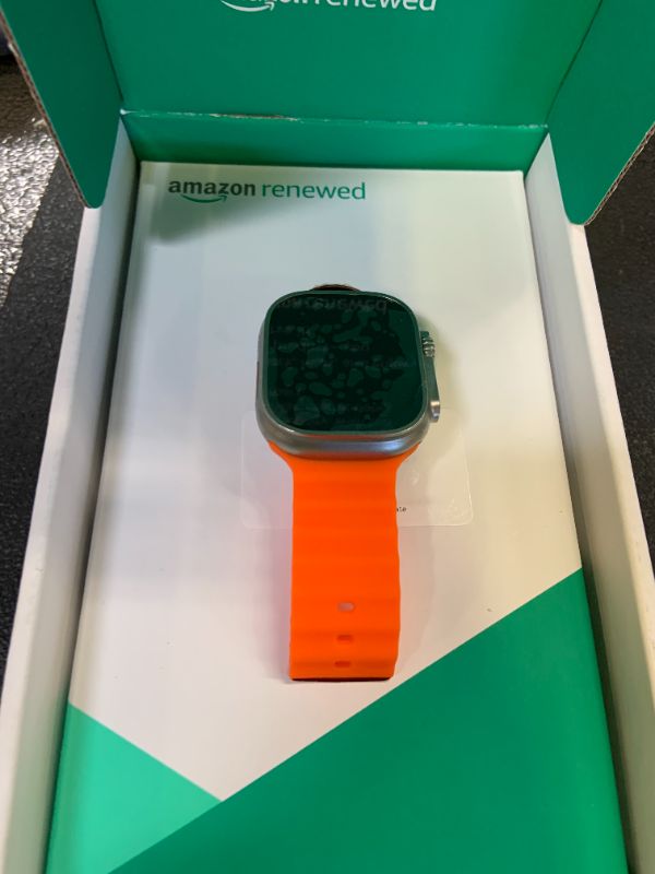 Photo 1 of Apple Watch Ultra 2 [GPS + Cellular, 49mm] - Rugged Titanium Case with Orange Ocean Band, One Size (Renewed Premium)