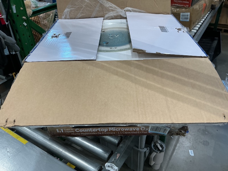 Photo 1 of [DAMAGED] GE Compact Countertop Microwave Oven, 1.1 Cubic Ft., 950w Capacity, 6 Auto Cook Settings, Child-Lock Technology, Dorm Room, Apartment, Stainless Steel