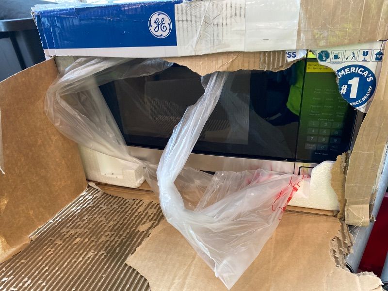 Photo 1 of [DAMAGED] GE Compact Countertop Microwave Oven, 1.1 Cubic Ft., 950w Capacity, 6 Auto Cook Settings, Child-Lock Technology, Dorm Room, Apartment, Stainless Steel