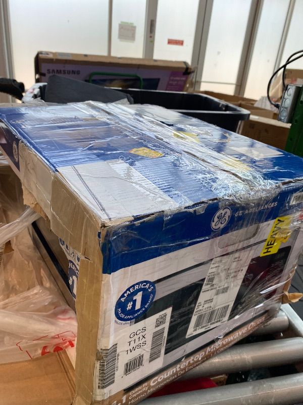 Photo 1 of [DAMAGED] GE Compact Countertop Microwave Oven, 1.1 Cubic Ft., 950w Capacity, 6 Auto Cook Settings, Child-Lock Technology, Dorm Room, Apartment, Stainless Steel