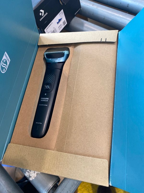 Photo 1 of ** MISSING SOME ACCESSORIES ** Philips Norelco Body Groomer 9000 Series, Intimate Trimmer for Bi-directional Use & Waterproof Wet Dry Body Shaver System with Foldable Back Attachment & UV Cube Cleaner, BG9485/50