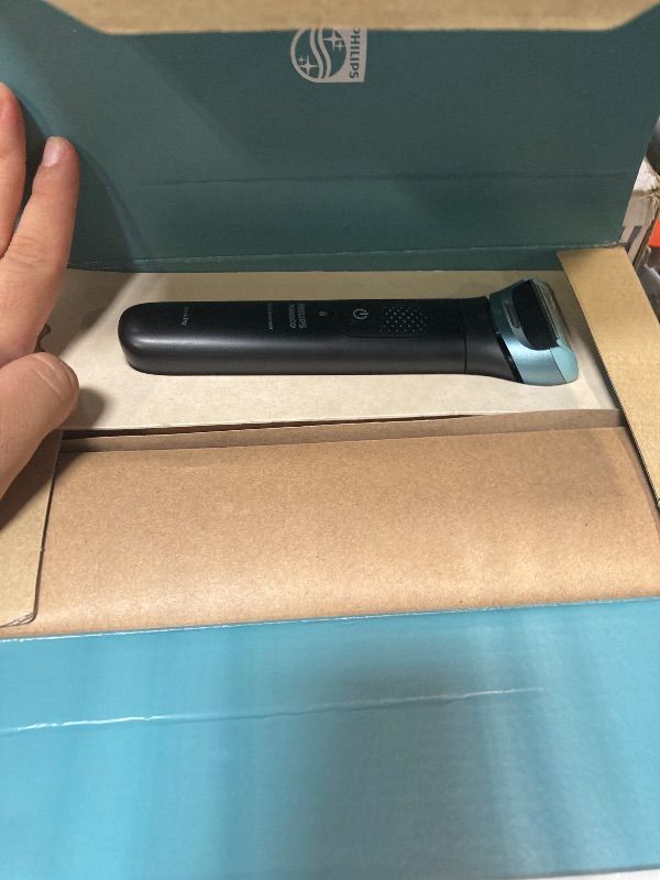 Photo 1 of ** MISSING SOME ACCESSORIES ** Philips Norelco Body Groomer 9000 Series, Intimate Trimmer for Bi-directional Use & Waterproof Wet Dry Body Shaver System with Foldable Back Attachment & UV Cube Cleaner, BG9485/50