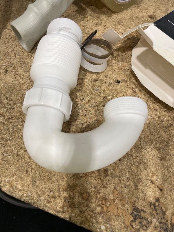 Photo 1 of 1 -1/2 inch flexible plastic drain p-trap
