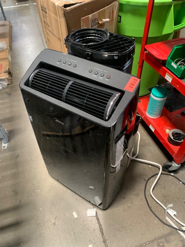 Photo 1 of **FOR PARTS, NONFUNCTIONAL**midea 14000 btu portable air conditioner
