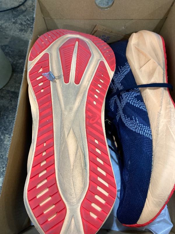 Photo 1 of ******MINOR TINY RIP ON TIP OF SHOE ******** ASICS Men's NOVABLAST 5 Running Shoes, 11, Midnight/Orange Glow