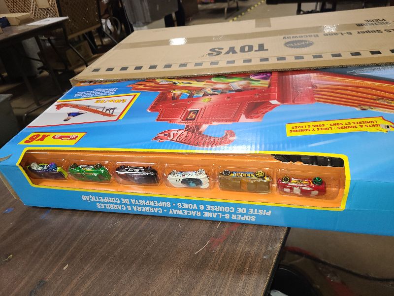 Photo 1 of ?Hot Wheels Super 6-Lane Raceway with Lights & Sounds, Includes 6 Hot Wheels Vehicles, Track Unfolds to 8 Feet, Collapses for Easy Storage, Gift for Kids 5 Years & Older