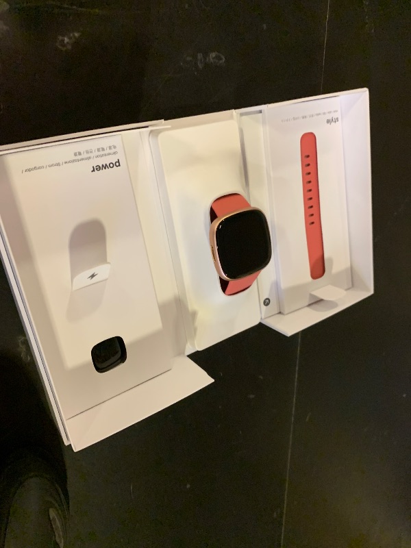 Photo 1 of Fitbit Versa 4 Smartwatch - Pink Sand/Copper Rose