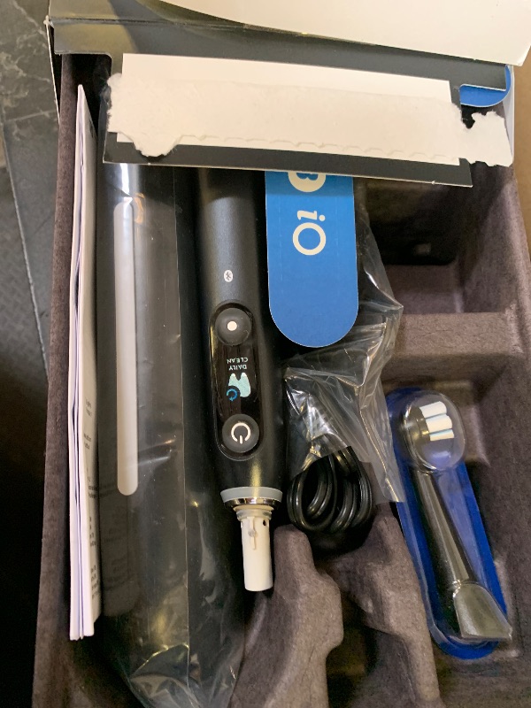 Photo 1 of Oral-B Rechargeable Electric Toothbrush, iO9 Limited Ultimate Clean, 7 Cleaning Modes, Interactive Display, iSense Charger, Charging Travel Case, Visible Pressure Sensor, 3 Brush Heads, Black