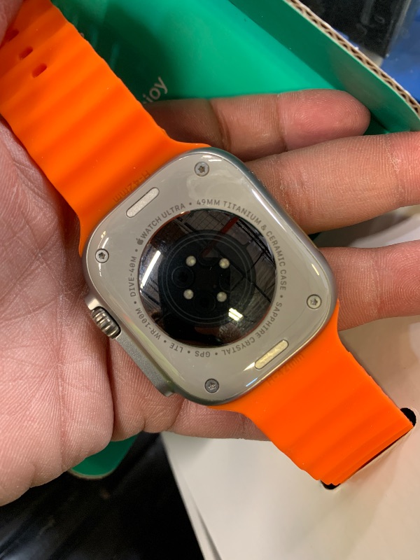 Photo 1 of Apple Watch Ultra 2 [GPS + Cellular, 49mm] - Rugged Titanium Case with Orange Ocean Band, One Size (Renewed Premium)