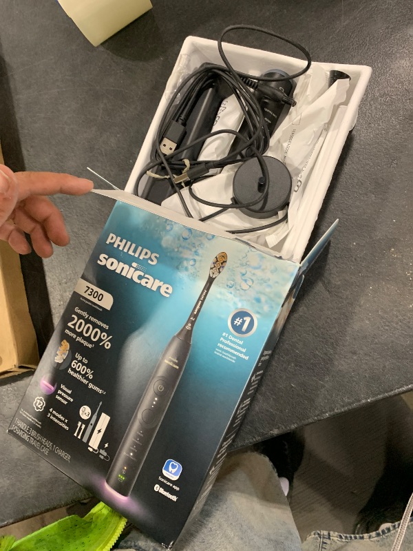 Photo 1 of Philips Sonicare 7300 Series Electric Toothbrush - Next-Generation Sonicare Technology, Pressure Sensor, 12 Brushing Settings, SmarTimer, BrushPacer, 21-Day Runtime, Travel Case, Black, HX7421/07