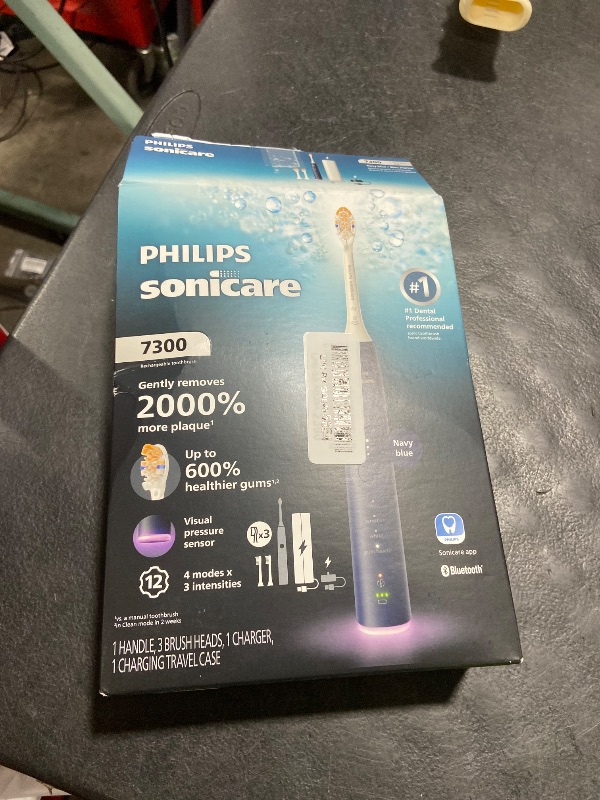 Photo 1 of Philips Sonicare 7300 Series Electric Toothbrush - Next-Generation Sonicare Technology, Pressure Sensor, 12 Brushing Settings, SmarTimer, 21-Day Runtime, Travel Case, Navy Blue, HX7423/05