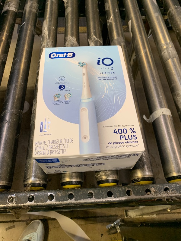 Photo 1 of Oral-B Rechargeable Electric Toothbrush, iO3 Limited Deep Clean, 3 Cleaning Modes, Visual Pressure Sensor to Protect Gums, 2 Brush Heads, Travel Case, ICY Blue
