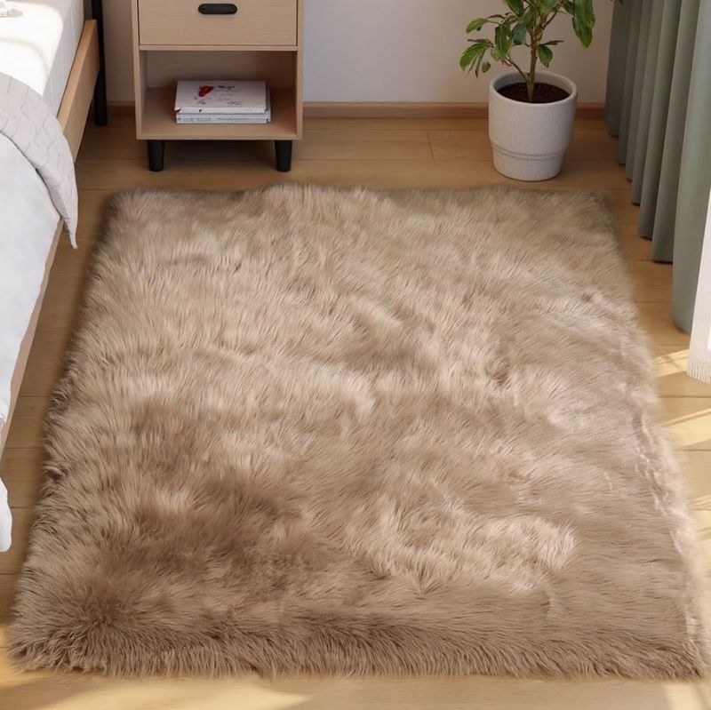 Photo 1 of ***USED***ORINOVA Beige Shag Faux Sheepskin Washable 4X6 Fur Rug for Living Room Bedroom Fluffy Furry Area Rug Rectangle Nursery Decor Rug