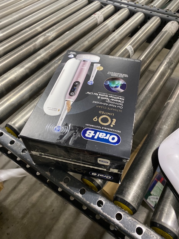 Photo 1 of Oral-B Rechargeable Electric Toothbrush, iO9 Limited Ultimate Clean, 7 Cleaning Modes, Interactive Display, iSense Charger, Charging Travel Case, Visible Pressure Sensor, 3 Brush Heads, Rose Quartz