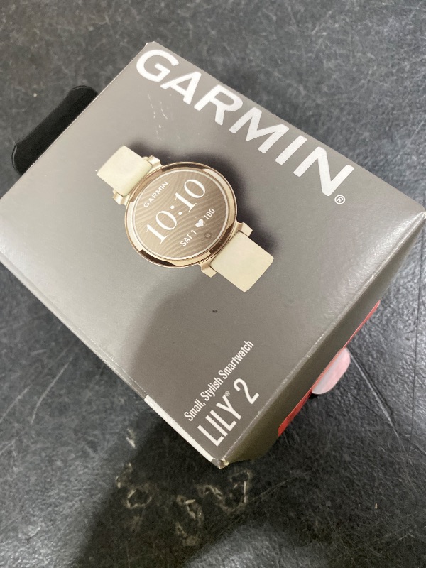 Photo 1 of Garmin Lily 2, Small and Stylish Smartwatch, Hidden Display, Patterned Lens, Up to 5 Days Battery Life, Coconut