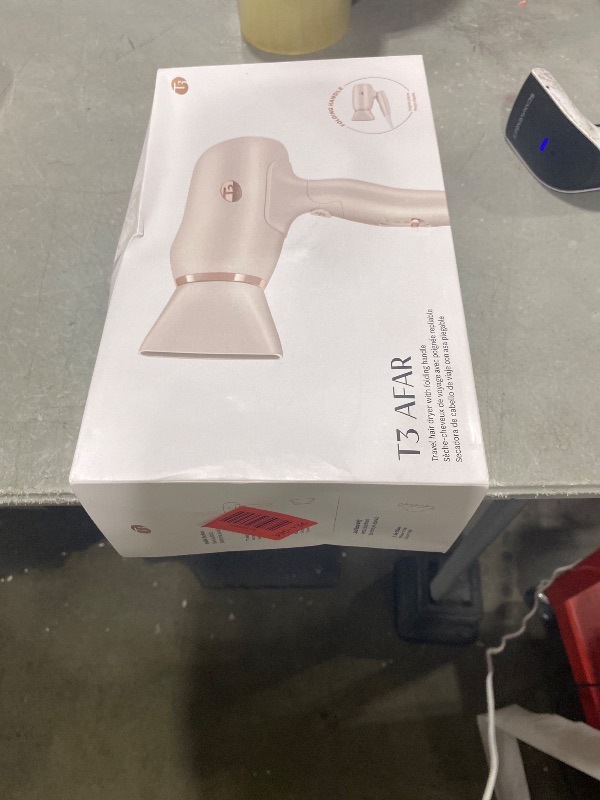 Photo 1 of T3 Afar Lightweight Travel-Size Hair Dryer with Auto Dual Voltage, Folding Handle, Fast Drying, Lightweight and Ergonomic, Frizz Smoothing, Multiple Heat and Speed Combinations