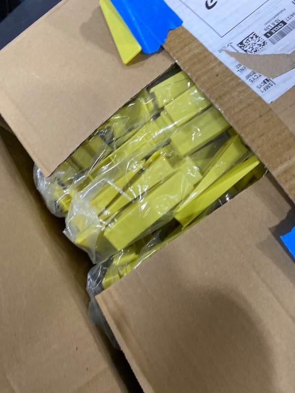 Photo 1 of Tile Leveling System Wedges, 1000pcs Reusable Tile Leveler Wedges for 1/8",1/12",1/16", 1/32" Spacer and Tile Leveling System Clips, Tile Leveler Tools for Wall/Floor Tile & Stone Installation(Yellow)