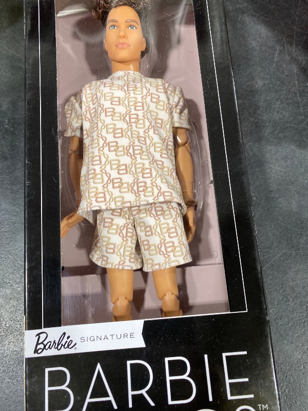 View 2 of Barbie Basics Model Collector Ken Fashion Doll 10 with Brunette Hair in Shirt & Shorts with Matching Print, Universal-fit Fashions & Posable Body