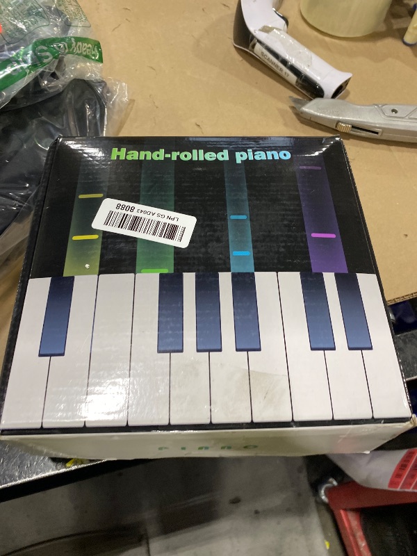 Photo 1 of KONIX 61 Key Roll Up Piano,Upgraded Portable Rechargeable Hand Roll Piano with Silicon Flexible Keyboard, MIDI Output, Headphone Connection, 128 Rhythms,Best Gift for Beginners