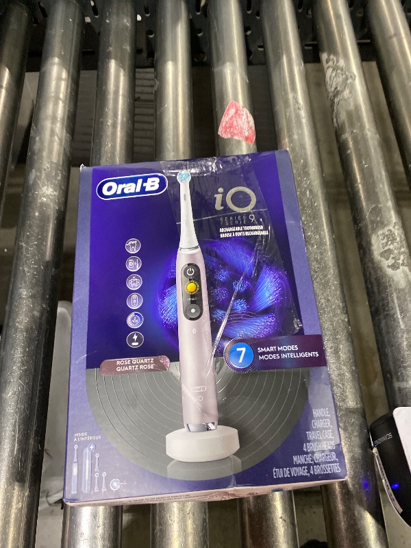 Photo 1 of Oral-B Rechargeable Electric Toothbrush, iO9 Genius, 7 Cleaning Modes, Interactive Display, Charging Travel Case, Visible Pressure Sensor, 4 Brush Heads, Rose Quartz