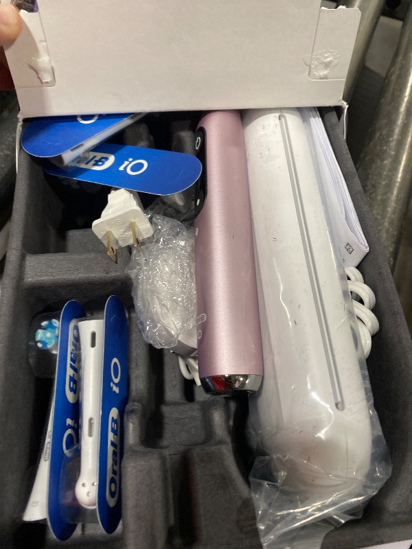 Photo 1 of Oral-B Rechargeable Electric Toothbrush, iO9 Genius, 7 Cleaning Modes, Interactive Display, Charging Travel Case, Visible Pressure Sensor, 4 Brush Heads, Rose Quartz