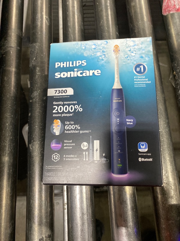 Photo 1 of Philips Sonicare 7300 Series Electric Toothbrush - Next-Generation Sonicare Technology, Pressure Sensor, 12 Brushing Settings, SmarTimer, 21-Day Runtime, Travel Case, Navy Blue, HX7423/05
