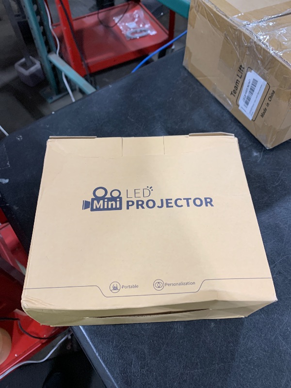 Photo 1 of Mini Projector for iPhone, Portable Projector with Tripod Stand, Full HD 1080P Supported Movie Projector, Home Theater Video Projector Compatible with Android, iOS, TV Stick, HDMI, USB, Laptop